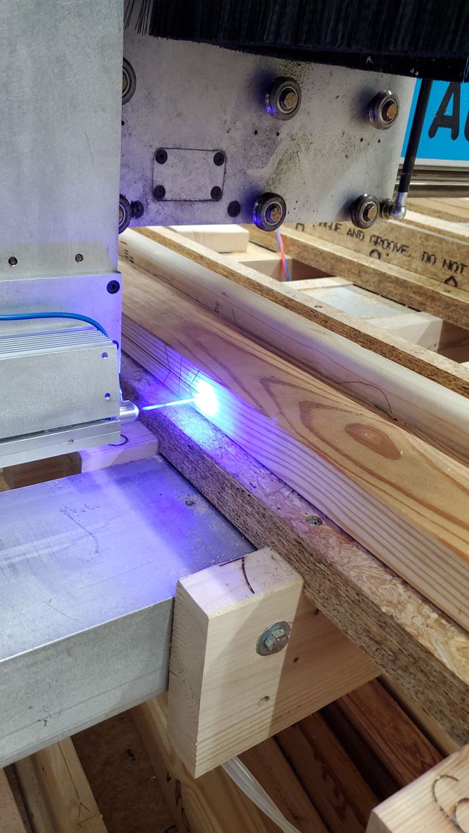 Laser engraving along the side of a long wood part