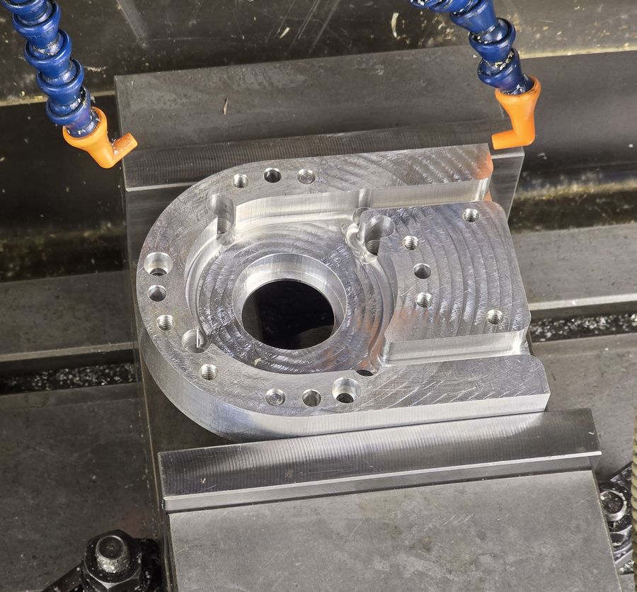 Precision-milled aluminum part with drilled and tapped holes